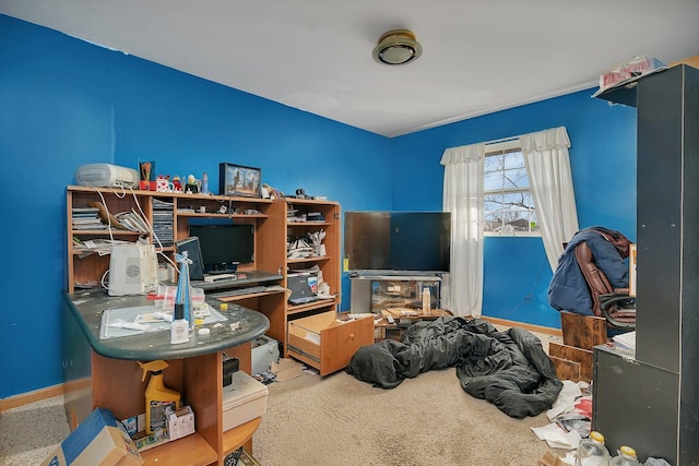 carpeted home office with baseboards