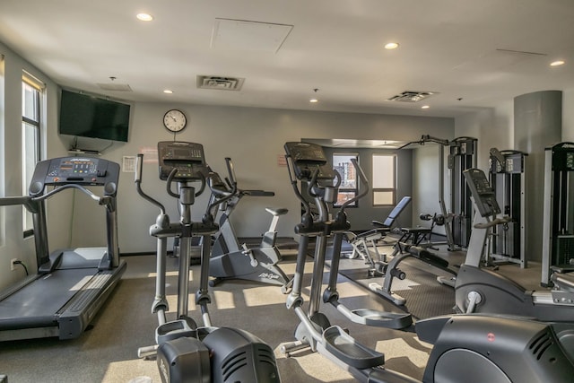 exercise room featuring recessed lighting and visible vents