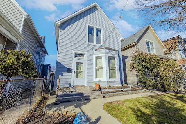 view of front of house featuring fence