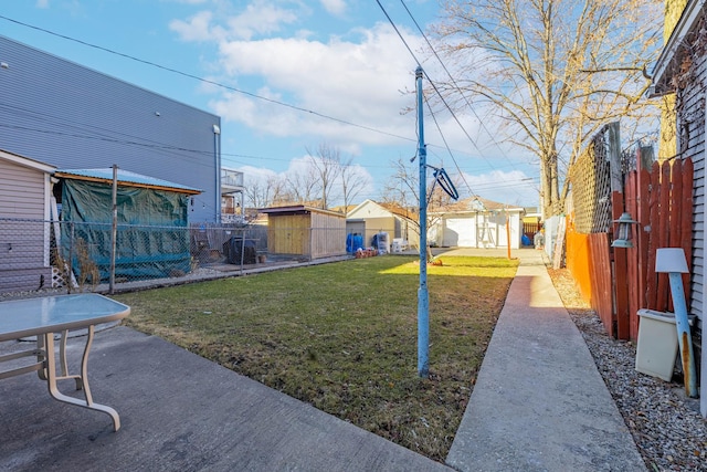 view of yard with an outdoor structure and fence