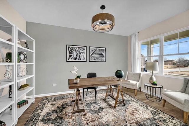 office space featuring dark wood-type flooring and baseboards