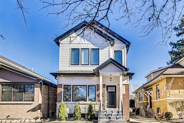 view of front of property featuring brick siding