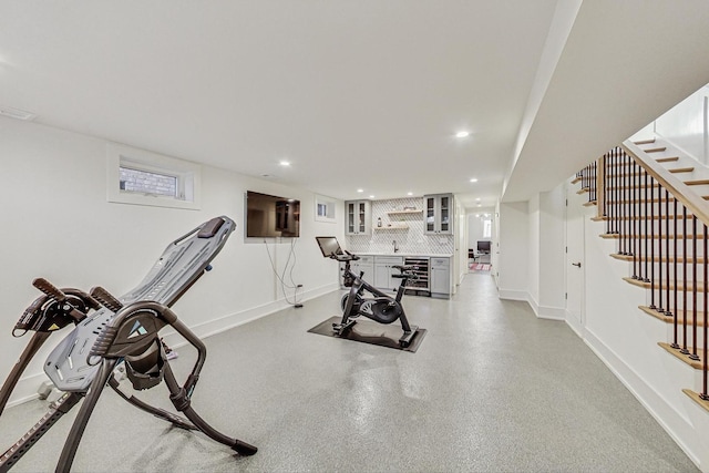 workout area featuring wine cooler, recessed lighting, and baseboards