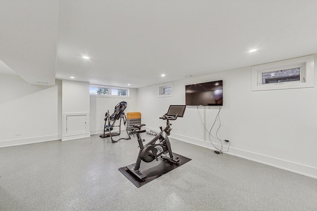 workout area featuring recessed lighting and baseboards