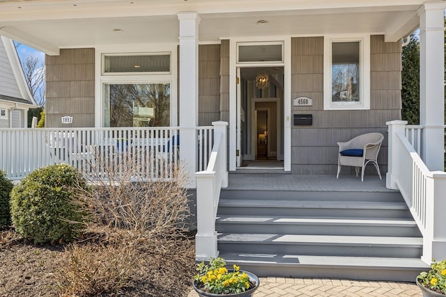 entrance to property featuring covered porch