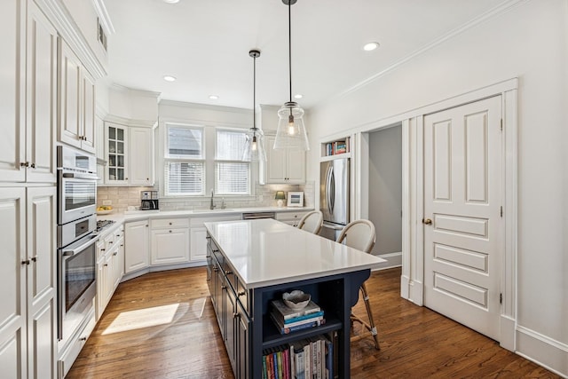 kitchen with tasteful backsplash, crown molding, white cabinets, stainless steel appliances, and open shelves