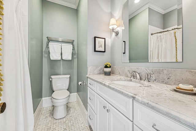 bathroom featuring tile patterned floors, toilet, crown molding, baseboards, and vanity