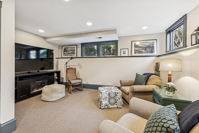 carpeted living room featuring recessed lighting, visible vents, and baseboards