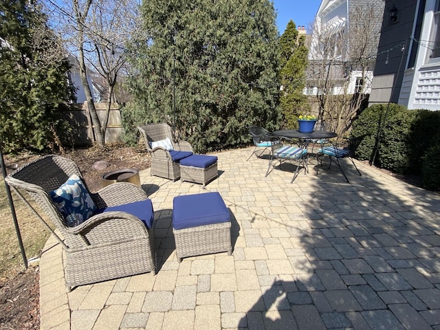 view of patio / terrace featuring outdoor dining area and fence