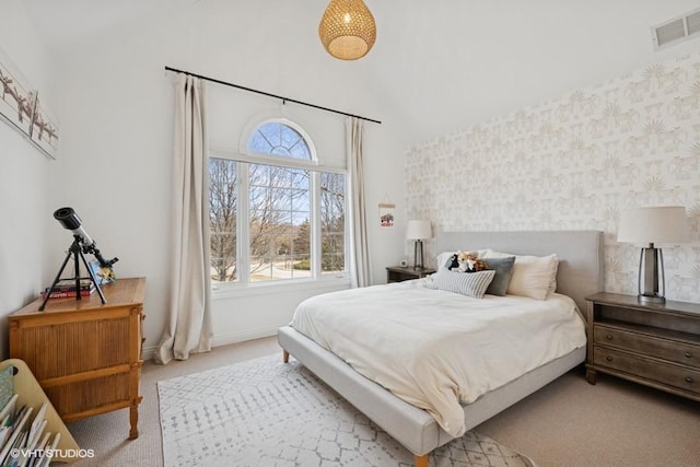 carpeted bedroom with wallpapered walls, baseboards, and visible vents