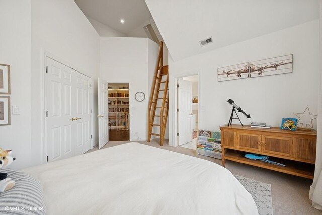 bedroom with visible vents, carpet floors, recessed lighting, a closet, and high vaulted ceiling