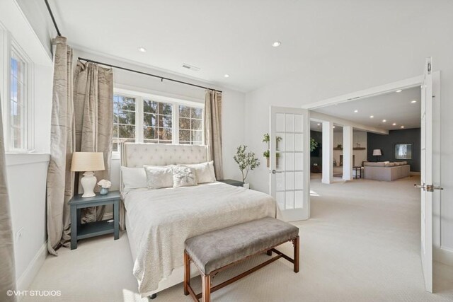 bedroom featuring carpet flooring, recessed lighting, and french doors