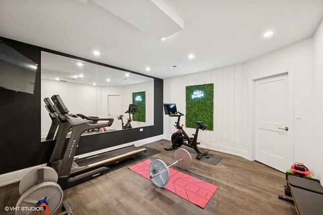 workout area with recessed lighting, baseboards, and wood finished floors