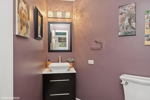 half bath with toilet and vanity