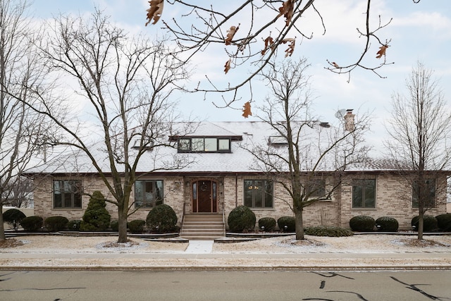 view of front of property featuring brick siding