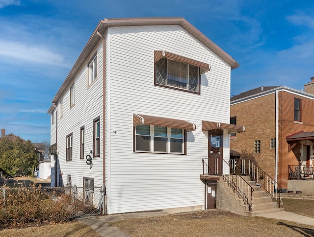 view of front of house with fence