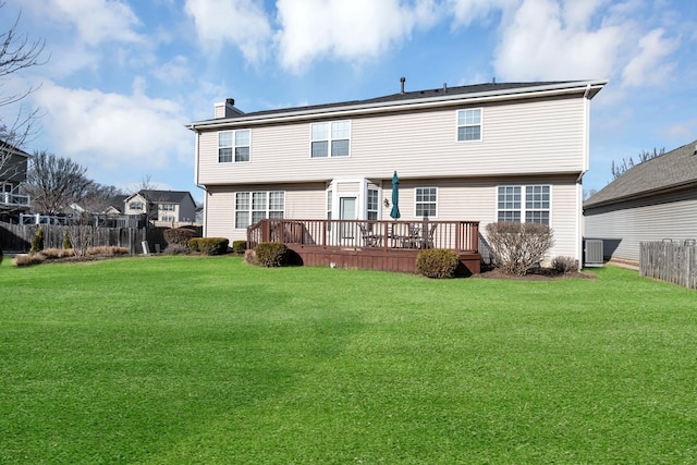 back of house with a lawn, central AC unit, a chimney, and fence