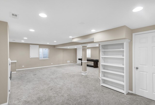 below grade area with recessed lighting, visible vents, carpet flooring, and baseboards