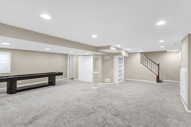 basement with recessed lighting, carpet flooring, and stairs