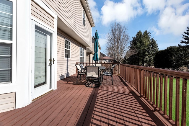 wooden deck featuring outdoor dining space