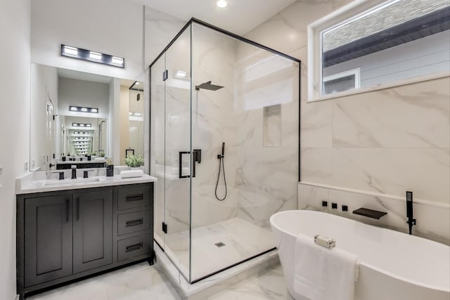 full bath with a marble finish shower, marble finish floor, and a freestanding bath