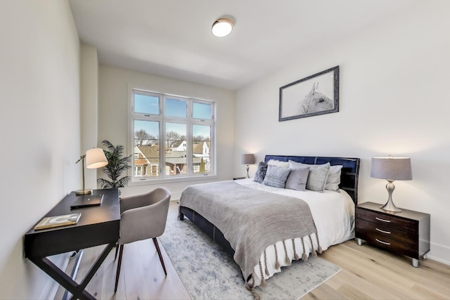 bedroom featuring light wood-style flooring