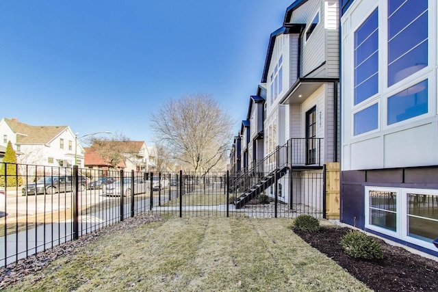 view of yard featuring a residential view and fence