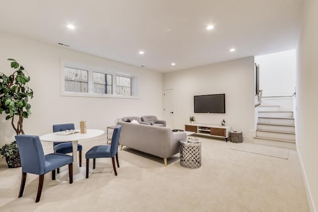 living area with stairway, recessed lighting, carpet flooring, and visible vents