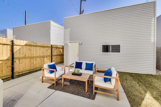 view of patio featuring an outdoor hangout area and fence