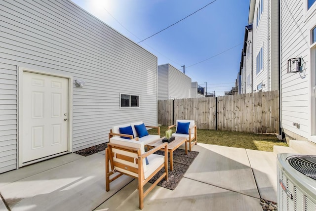 view of patio / terrace featuring central AC unit and fence