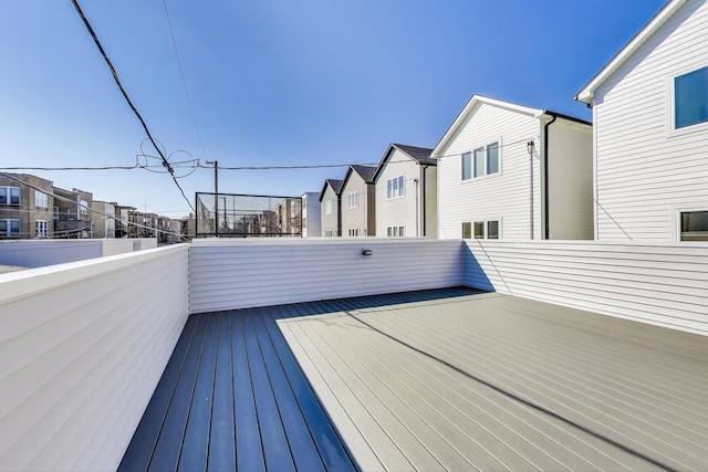 wooden deck with a residential view