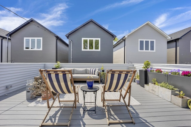 deck with an outdoor hangout area