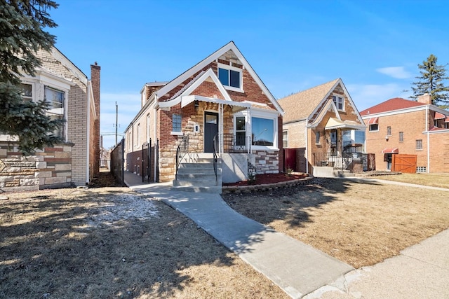 view of front of house with stone siding and brick siding