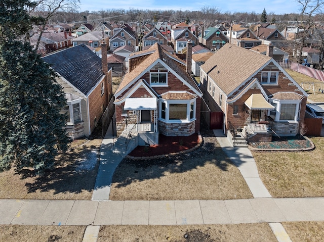 birds eye view of property with a residential view