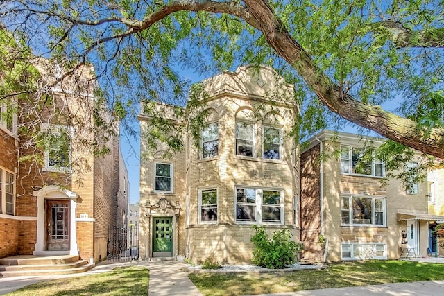 view of front of home featuring brick siding