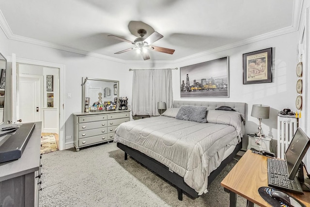 bedroom featuring crown molding, carpet flooring, and ceiling fan