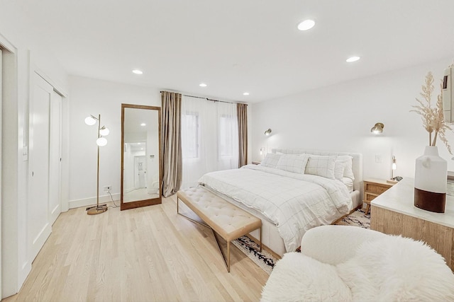 bedroom featuring recessed lighting, light wood-type flooring, and baseboards