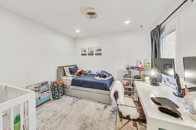 bedroom featuring recessed lighting and wood finished floors