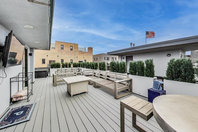 wooden deck featuring an outdoor hangout area and outdoor dining area