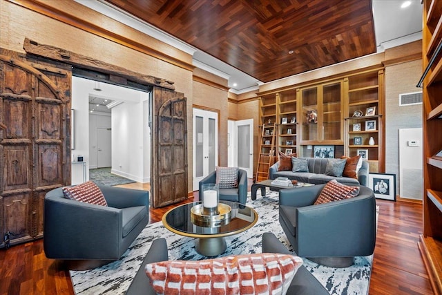 living room featuring visible vents, dark wood finished floors, wooden ceiling, crown molding, and baseboards