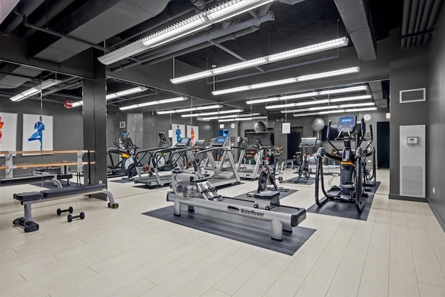 exercise room featuring visible vents