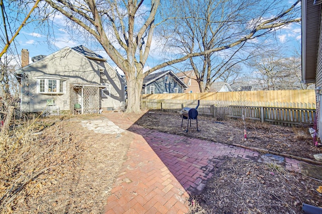 view of yard featuring a patio and a fenced backyard