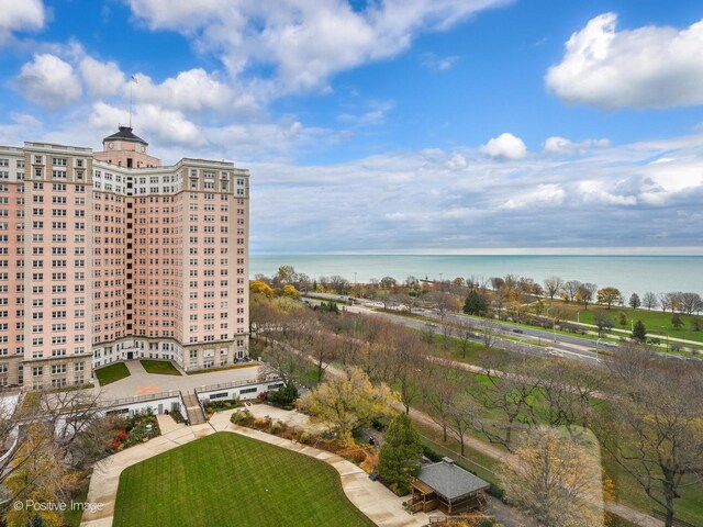 birds eye view of property featuring a water view