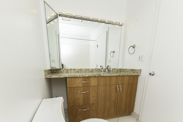 bathroom with vanity and tile patterned floors