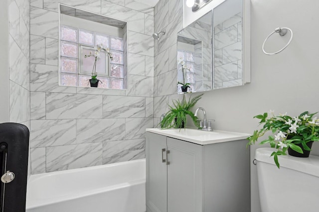 bathroom featuring vanity, shower / tub combination, and toilet