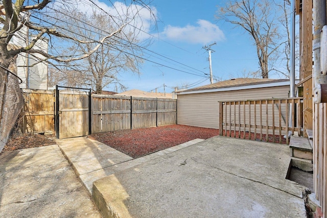 view of yard with a patio area, a gate, and a fenced backyard