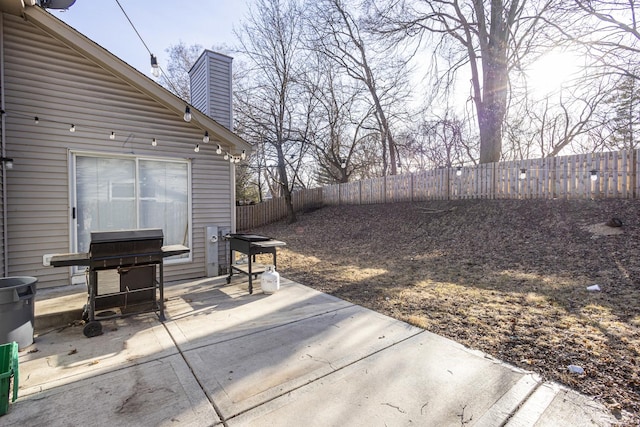 view of patio featuring grilling area and a fenced backyard