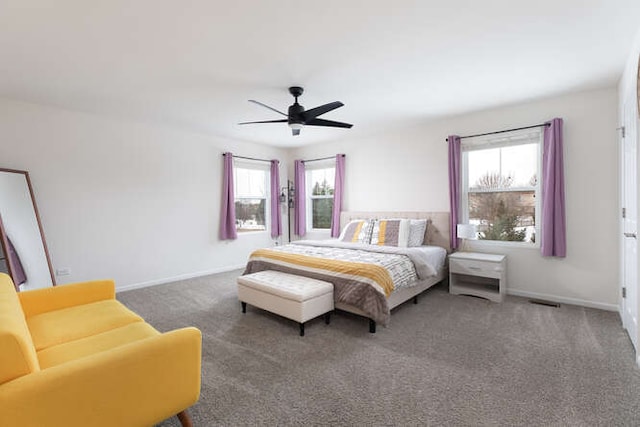 bedroom with visible vents, ceiling fan, baseboards, and carpet floors