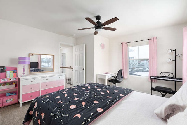 bedroom featuring a ceiling fan and carpet