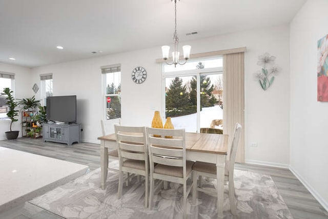 dining area featuring plenty of natural light, recessed lighting, and baseboards